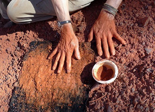 Hands in Red Clay